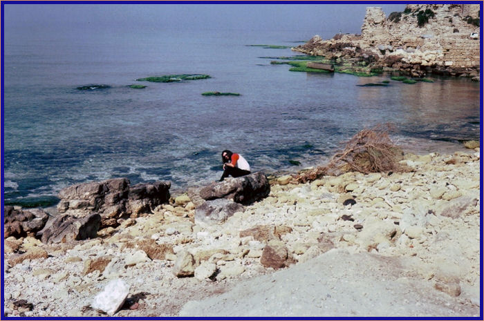 Me dipping my hand into the Mediterranean Sea